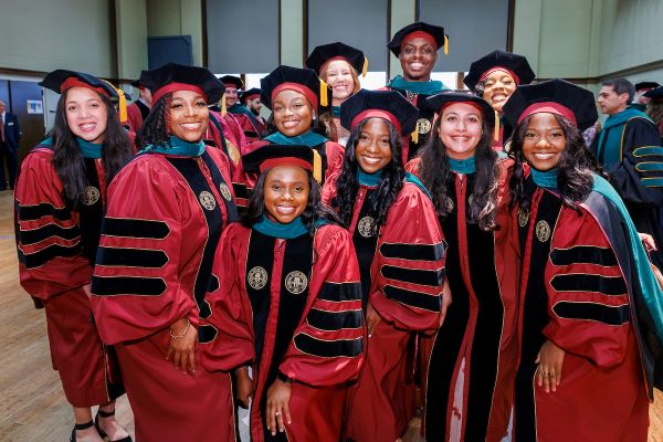 Group photo of several medical students at graduation
