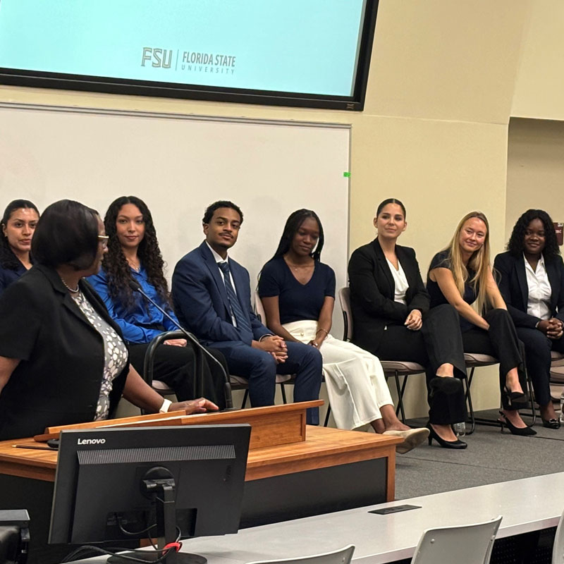 Dean Alma Littles addresses the seven members of the Bridge to Clinical Medicine Class of 2026.