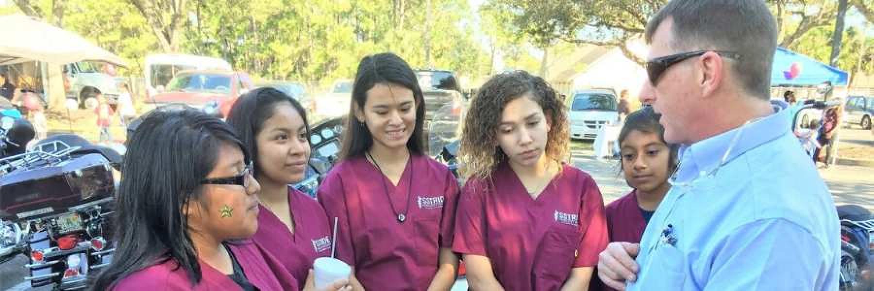 Students learning about CPR mannequins