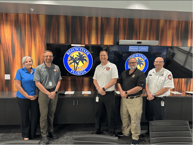 Group of fellows pose with local emergency responders