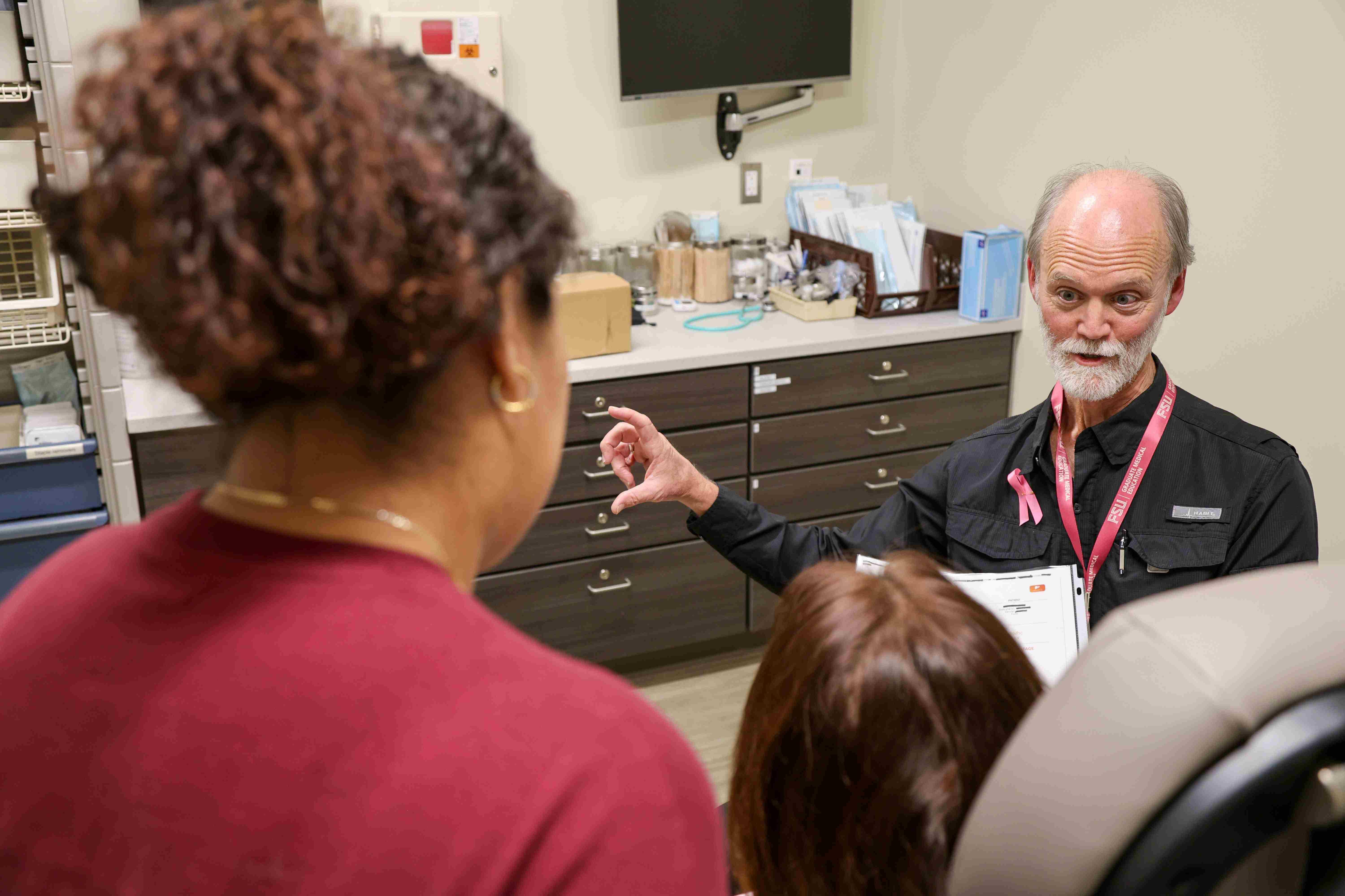 Dr. Whiddon discusses liver scan results with patient