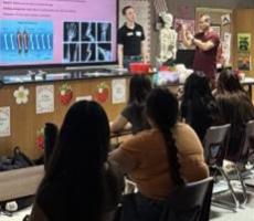 Thumbnail image for Bridging Education and Medicine: Bone Break Workshop for Immokalee SSTRIDE Students. Image is of an ongoing presentation in front of the class.