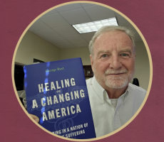 Photo of George Rust holding book