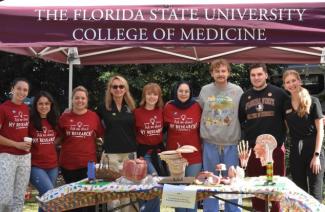 Group of students standing with anatomy models