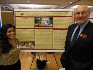 professor with student in front of post