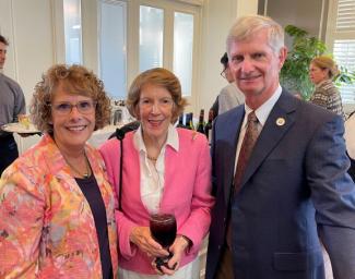 Dr. John Fogarty, Dean of the College of Medicine with his wife Diane, standing with our long time Thomasville medical student supporter, Teresa Brown. 