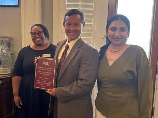 Eugene Sun, M.D., receiving the Outstanding Clinical Faculty Award.