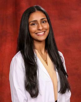 Dhenu Patel white coat thumbnail