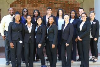 Standing with Bridge students are Anthony Speights and Liz Foster.