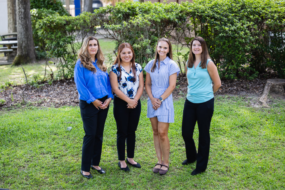 Current OB Fellows posing together on a lawn
