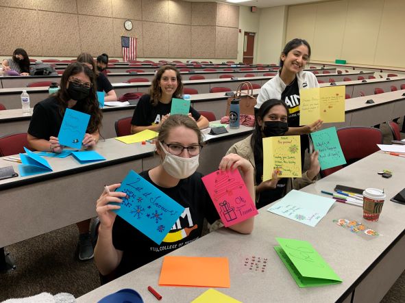 Volunteers Decorating Art Kits