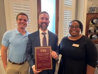 Patrick Hawkins, M.D., receiving the Mission Model Award.